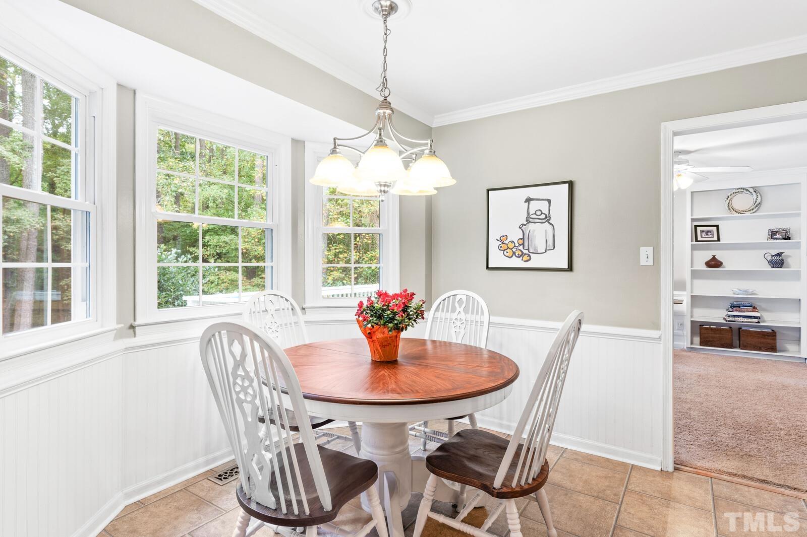 8312 Heel Stone Court Raleigh, NC 27613 - Photo 8 of 30 a dining room with furniture and window