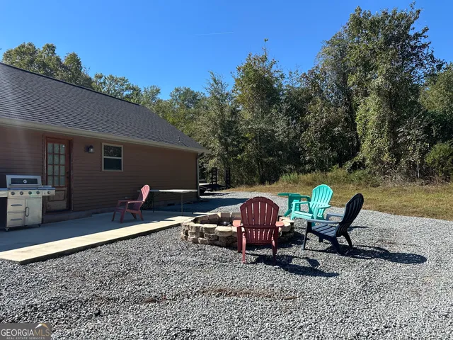 a view of a terrace with couches and sky view