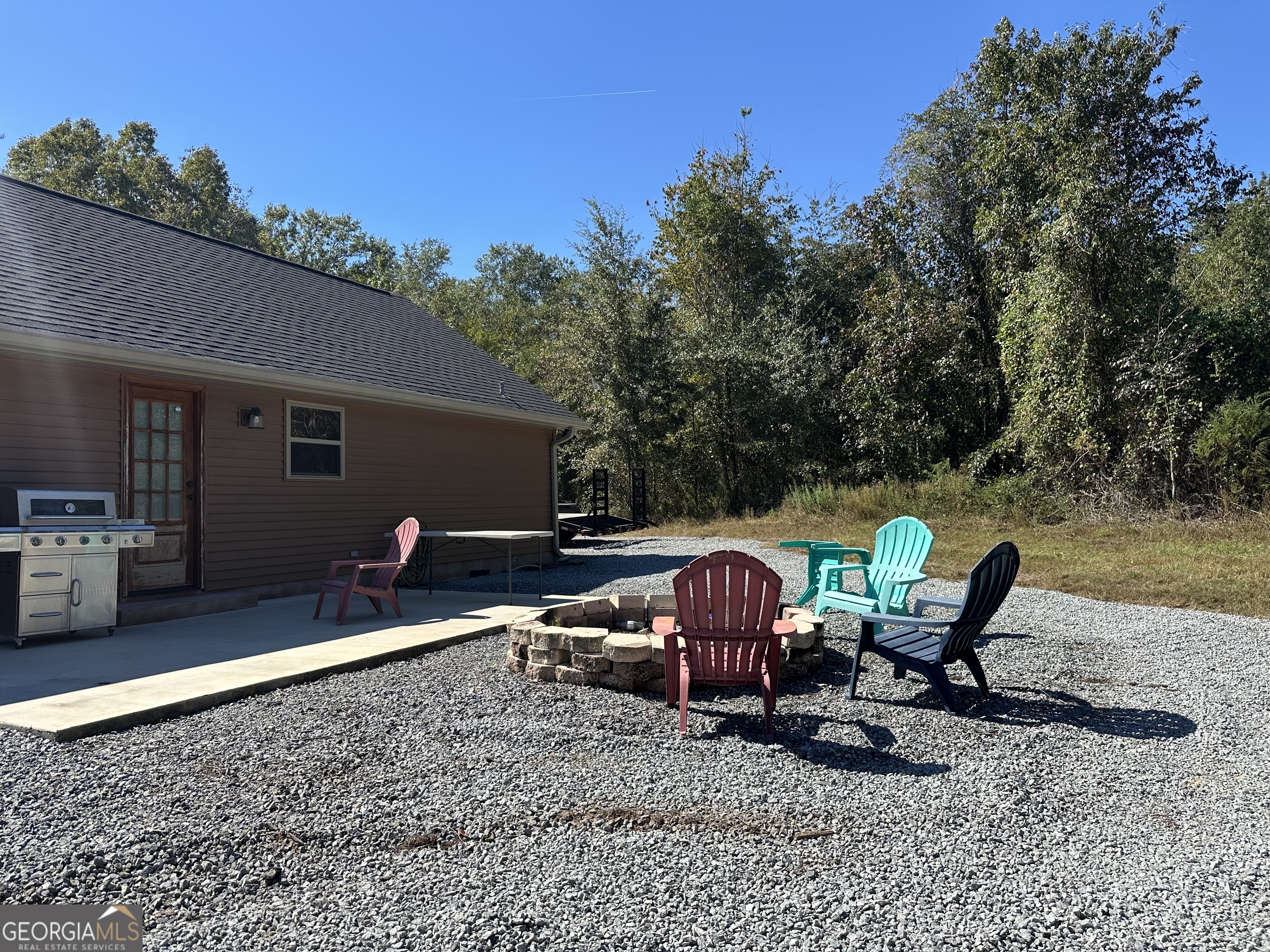 68 Sand Rdg Road Rhine, GA 31077 - Photo 14 of 54 a view of a backyard with furniture and slide