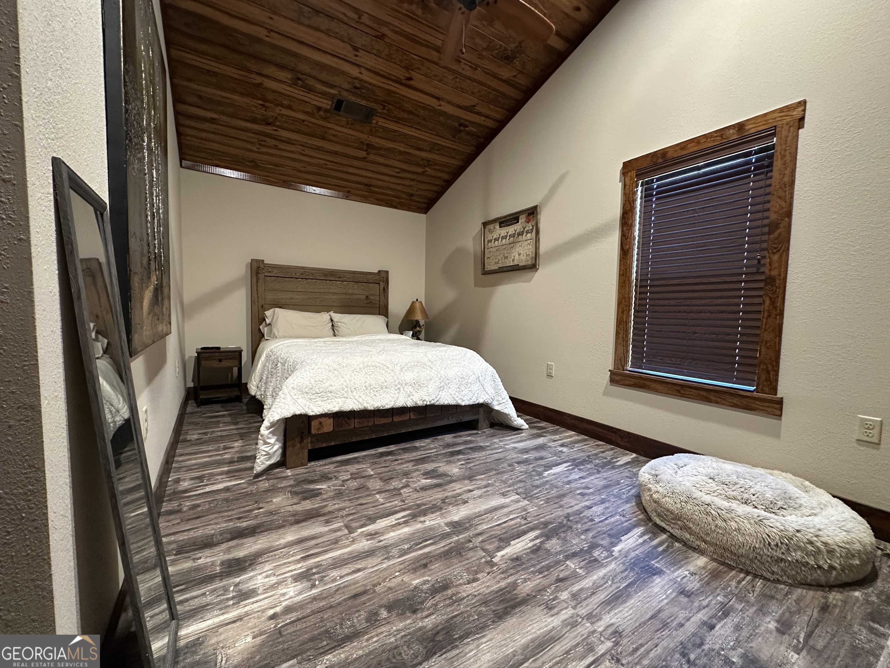 68 Sand Rdg Road Rhine, GA 31077 - Photo 22 of 54 a bedroom with a bed wooden floor and a window