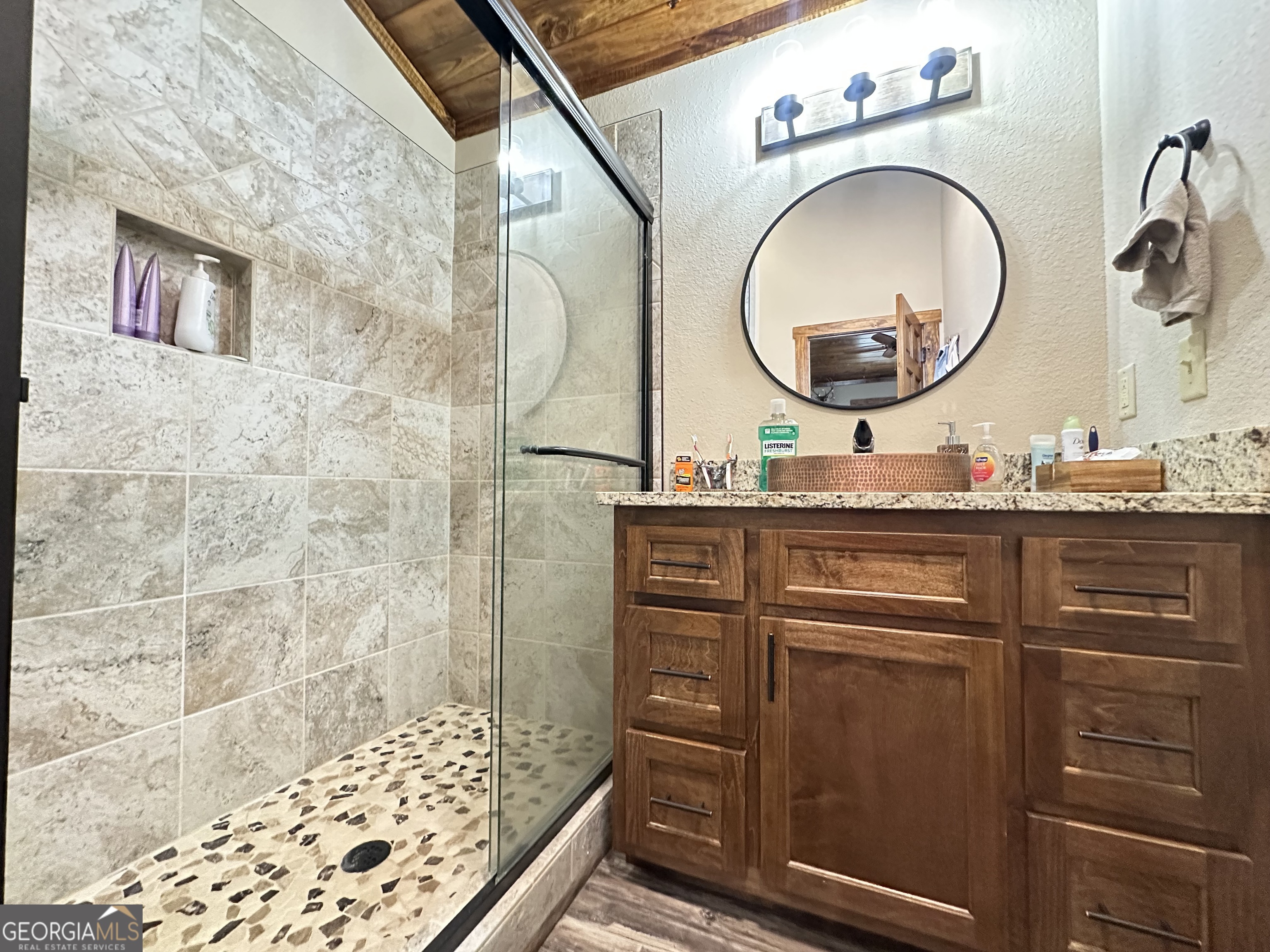68 Sand Rdg Road Rhine, GA 31077 - Photo 28 of 54 a bathroom with a granite countertop sink a mirror and shower