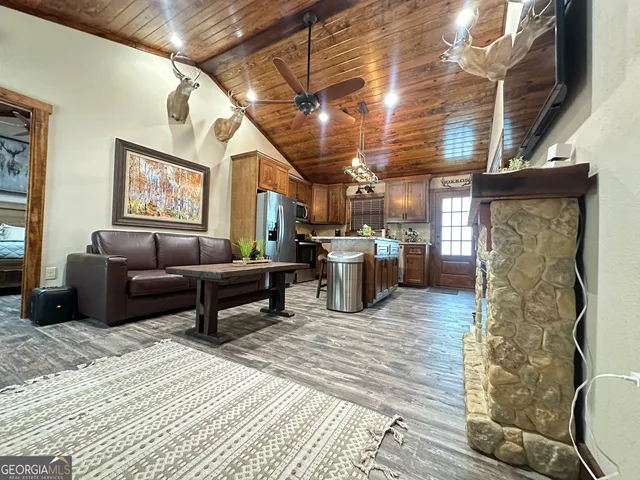 a living room with furniture and a kitchen