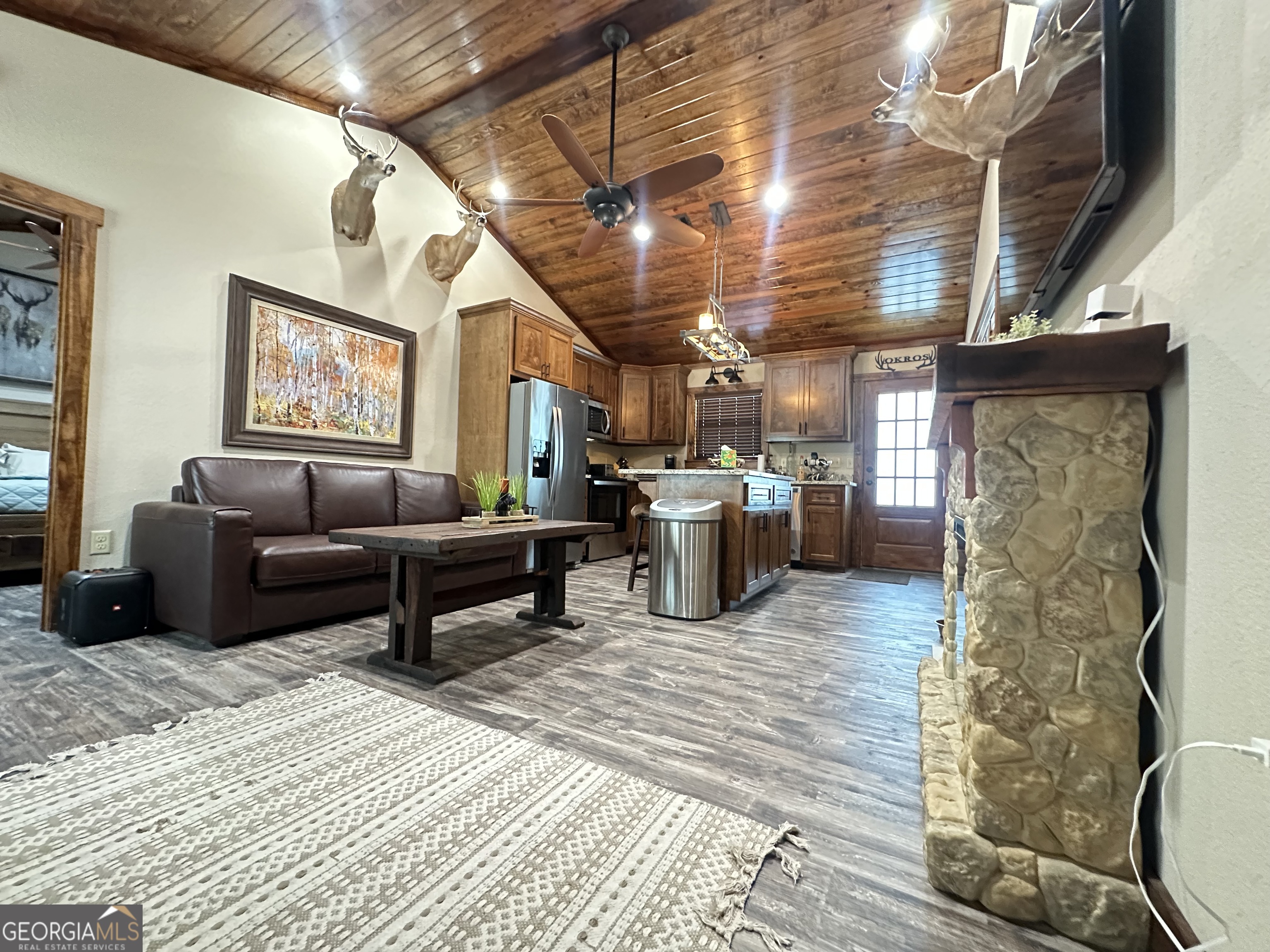 68 Sand Rdg Road Rhine, GA 31077 - Photo 3 of 54 a living room with furniture and a kitchen