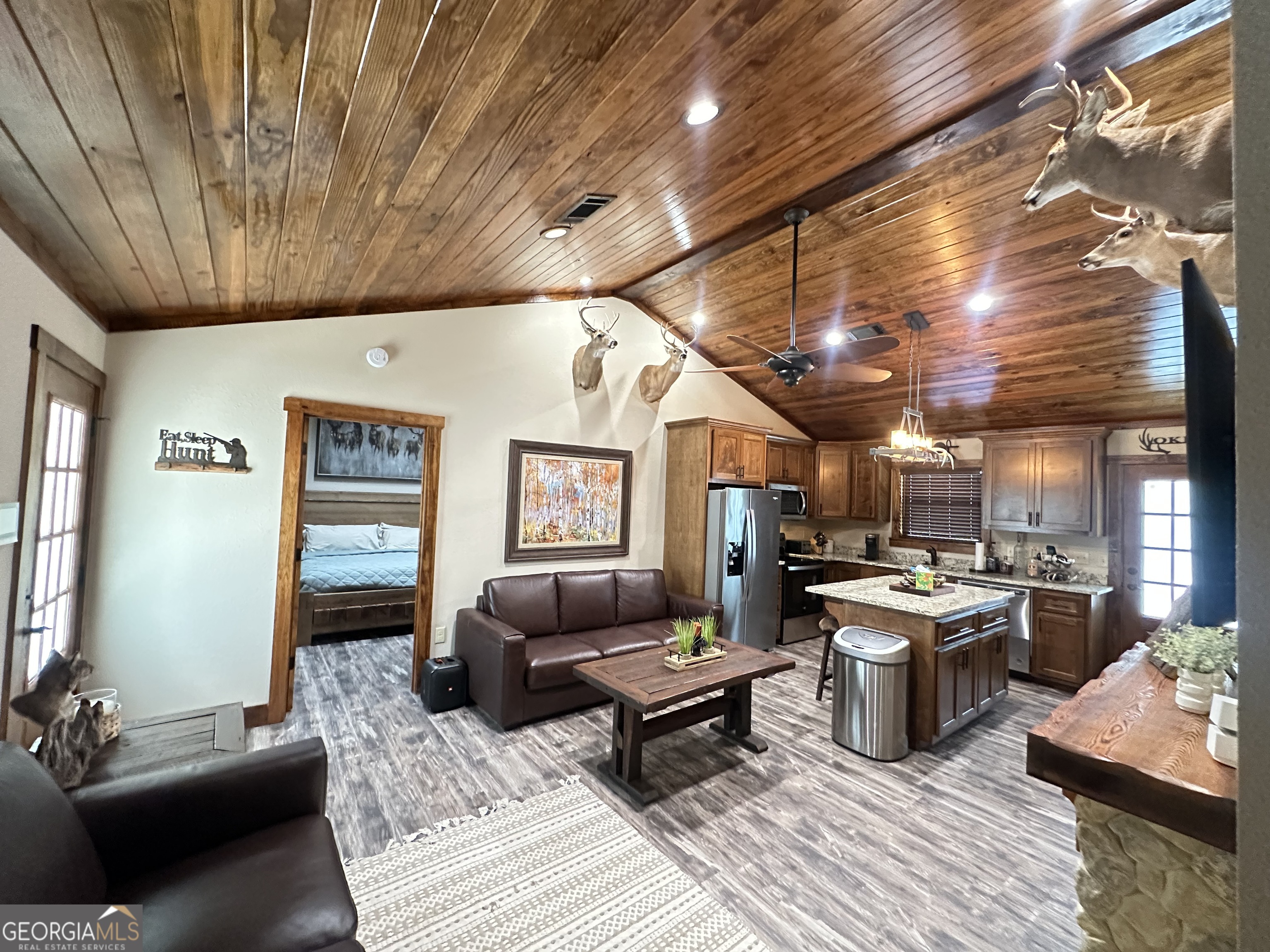 68 Sand Rdg Road Rhine, GA 31077 - Photo 5 of 54 a living room with lots of furniture and kitchen view
