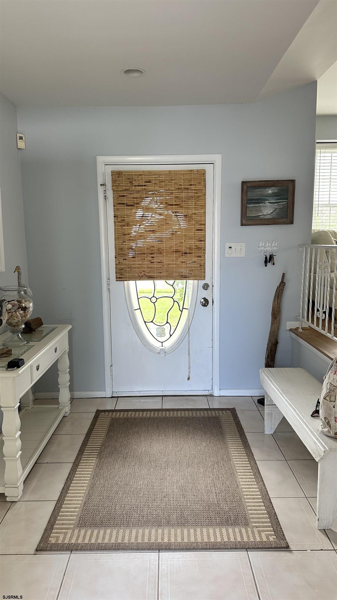 a view of room with window and wooden floor
