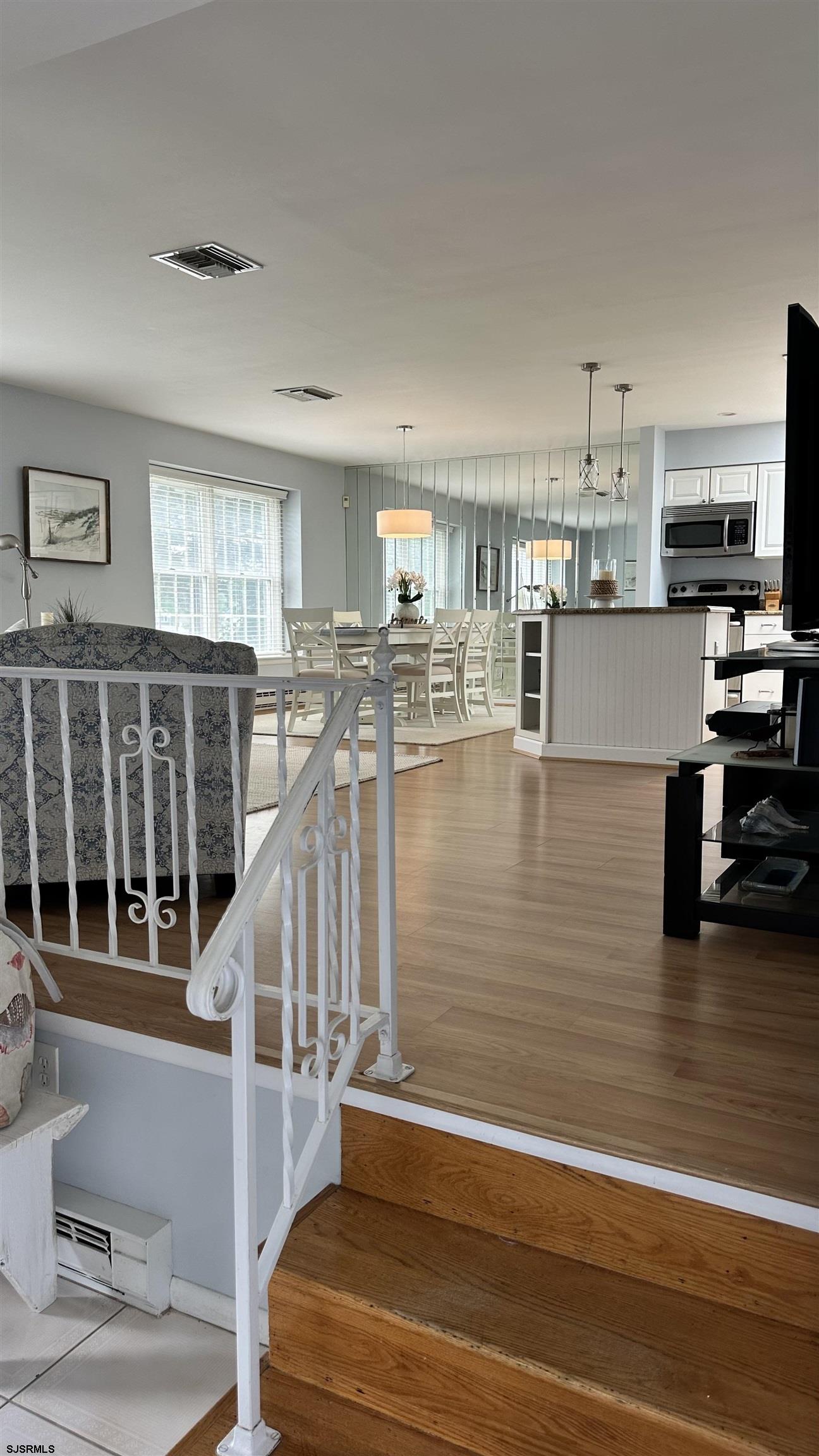 3 Sandy Lane Brigantine, NJ 08203 - Photo 2 of 11 a view of a living room and kitchen view