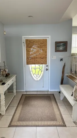 a view of room with window and wooden floor