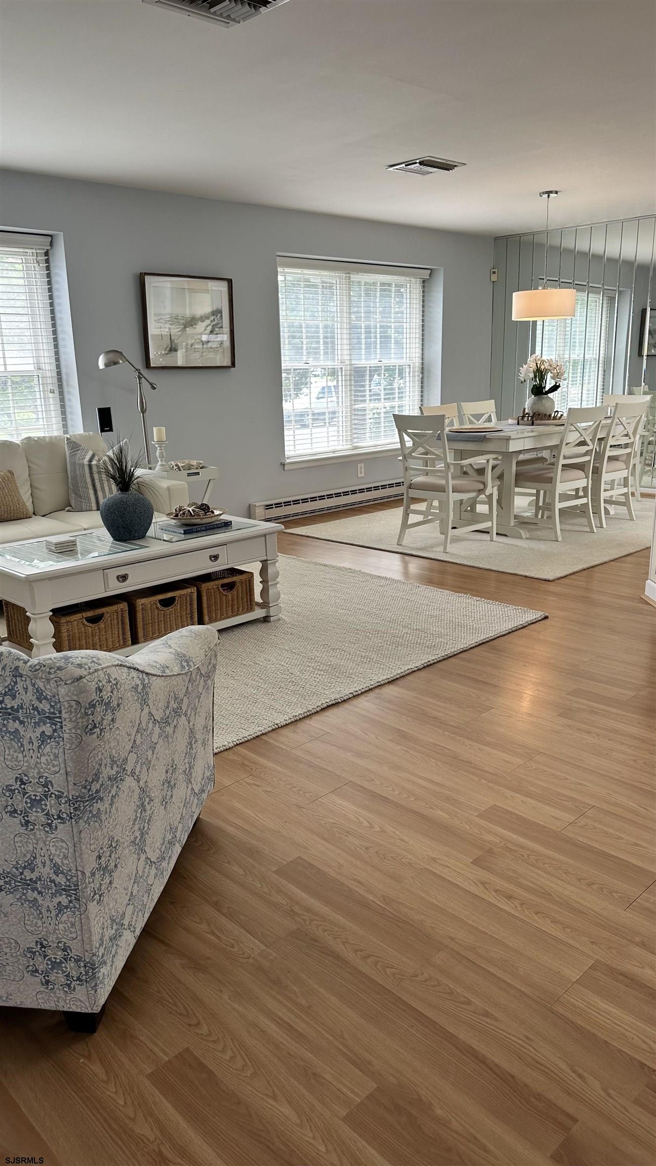 3 Sandy Lane Brigantine, NJ 08203 - Photo 3 of 11 a living room with furniture wooden floor and a large window
