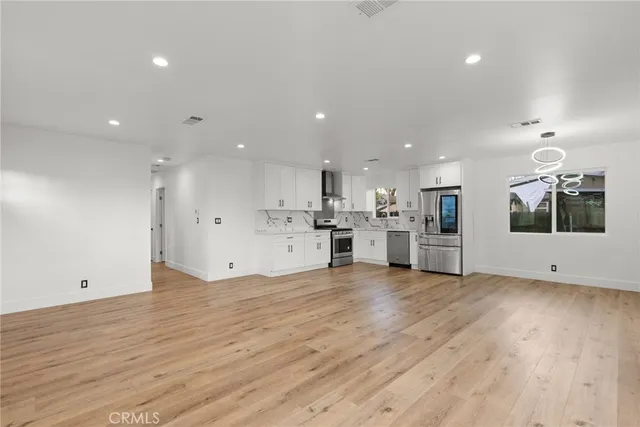 a view of kitchen with wooden floor