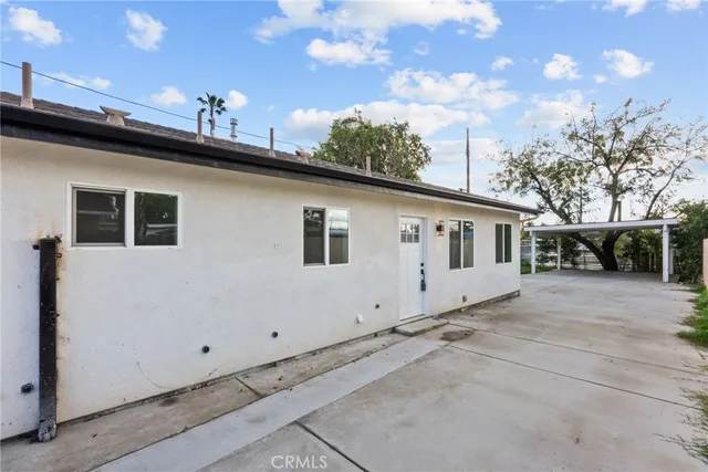 a view of a white house with a large windows