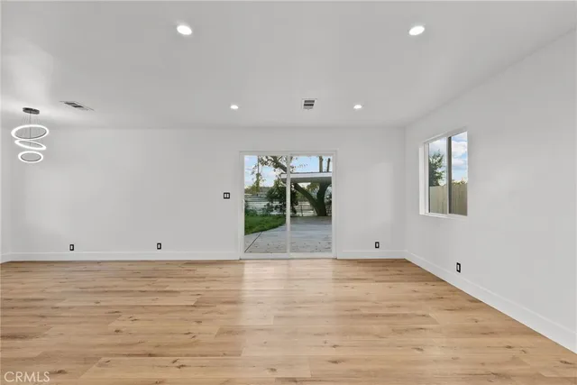 a view of room with wooden floor