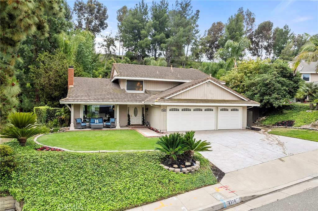 4370 East Rocky Point Road Anaheim Hills, CA 92807 - Photo 1 of 1 a front view of a house with a garden