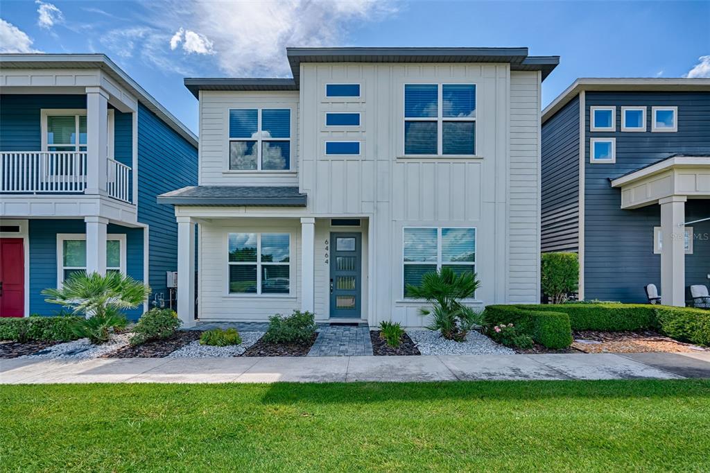a front view of a house having yard