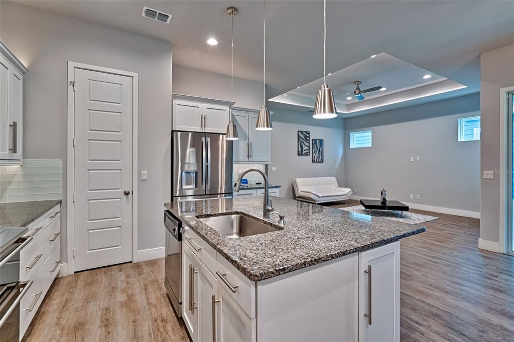 6464 Southwest 77th Street Gainesville, FL 32608 - Photo 13 of 41 a kitchen with stainless steel appliances granite countertop a sink and dishwasher