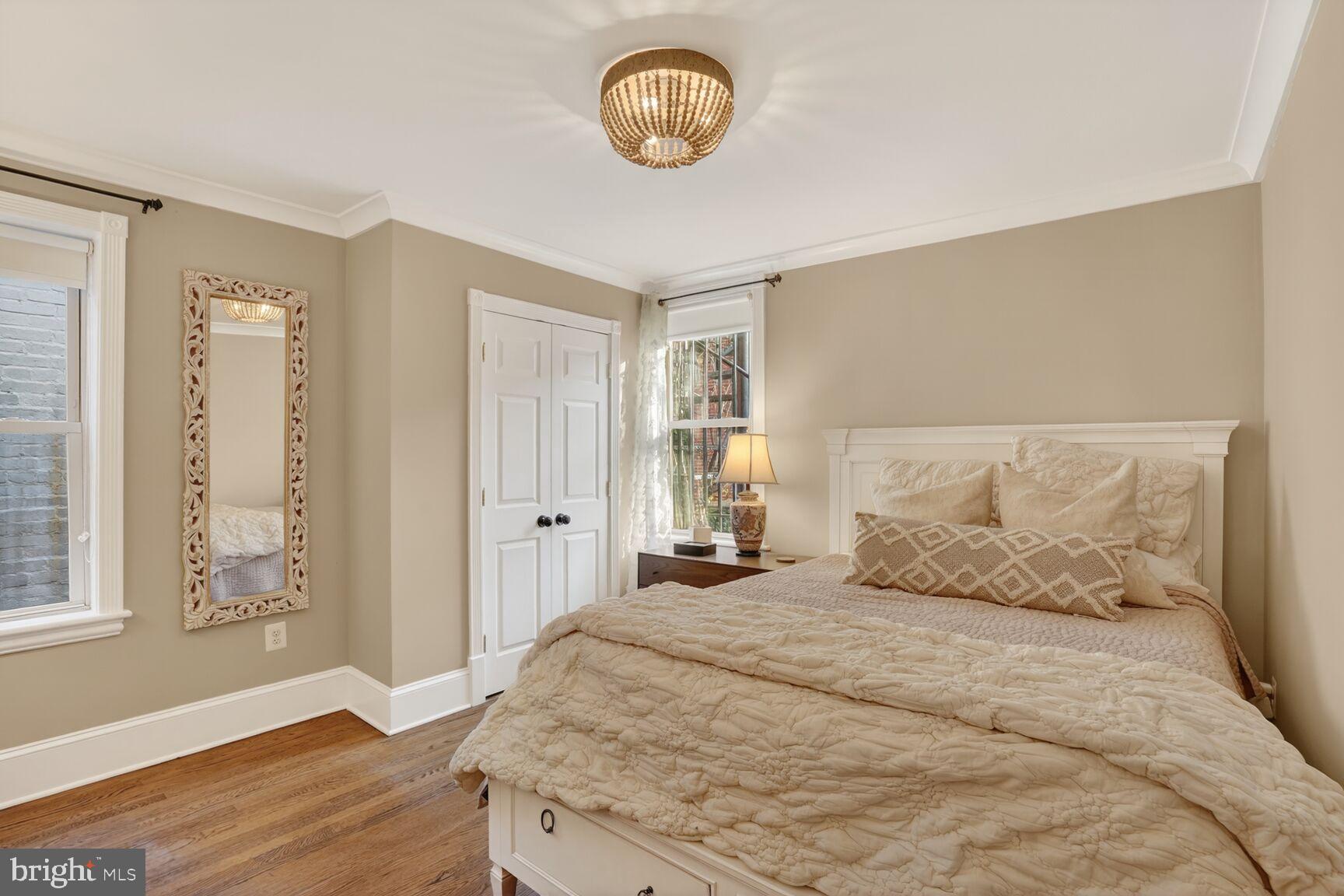 1316 Florida Avenue Northwest Washington, DC 20009 - Photo 22 of 43 a bedroom with a bed and a window