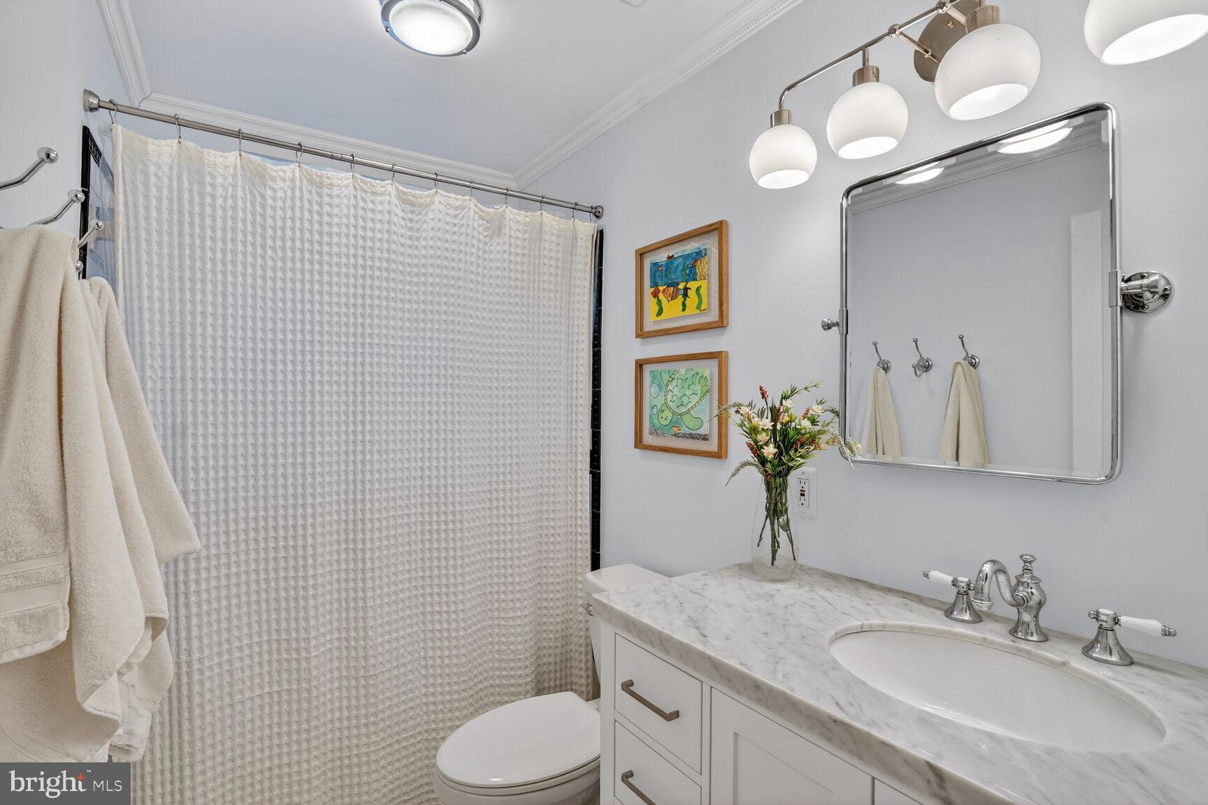 1316 Florida Avenue Northwest Washington, DC 20009 - Photo 25 of 43 a bathroom with a granite countertop sink vanity mirror and toilet