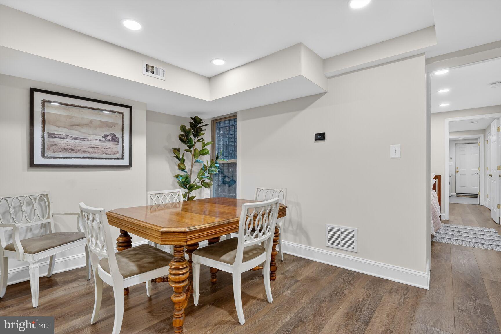 1316 Florida Avenue Northwest Washington, DC 20009 - Photo 30 of 43 a dining room with furniture and wooden floor
