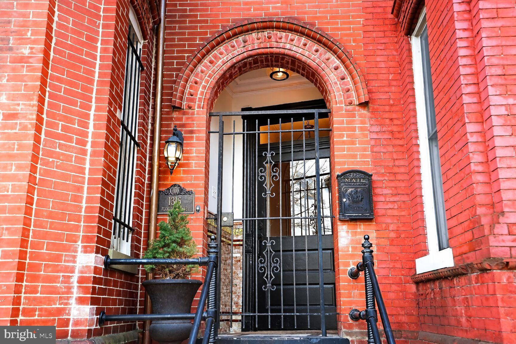 1316 Florida Avenue Northwest Washington, DC 20009 - Photo 3 of 43 front view of a brick house with a door