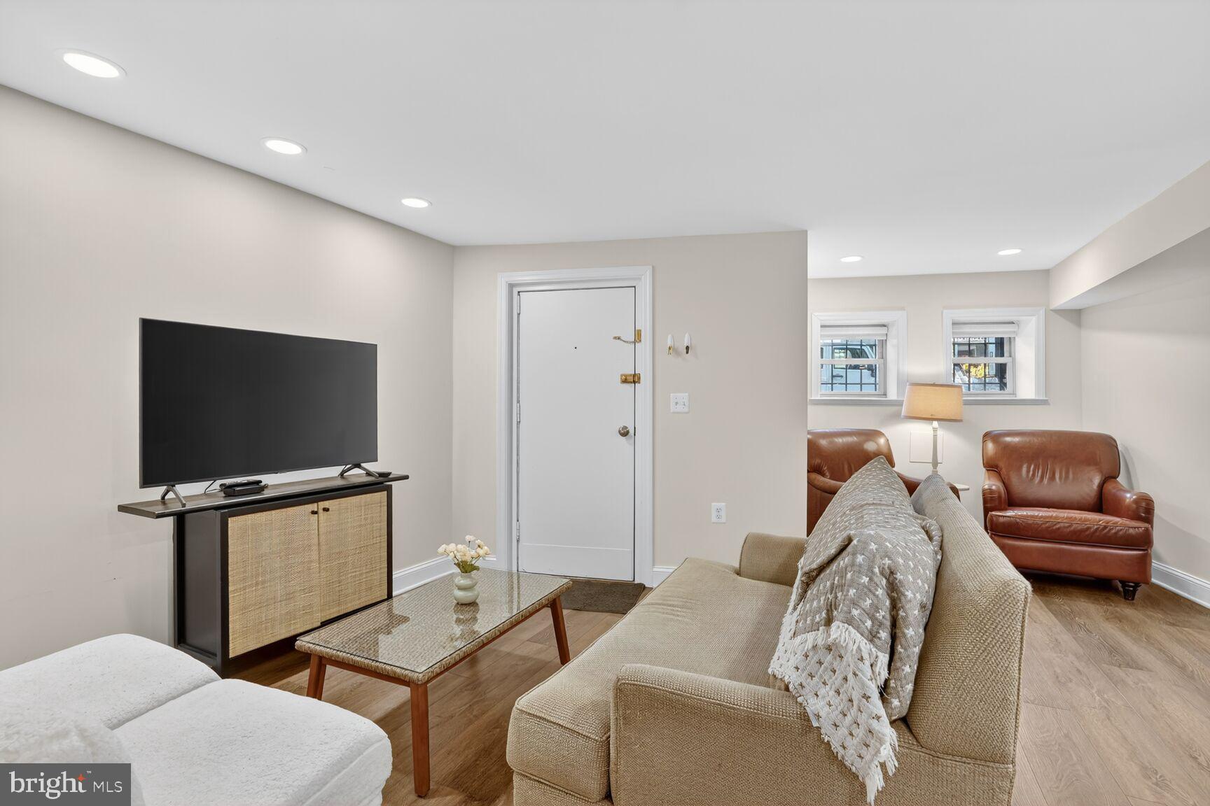 1316 Florida Avenue Northwest Washington, DC 20009 - Photo 32 of 43 a living room with furniture and a flat screen tv