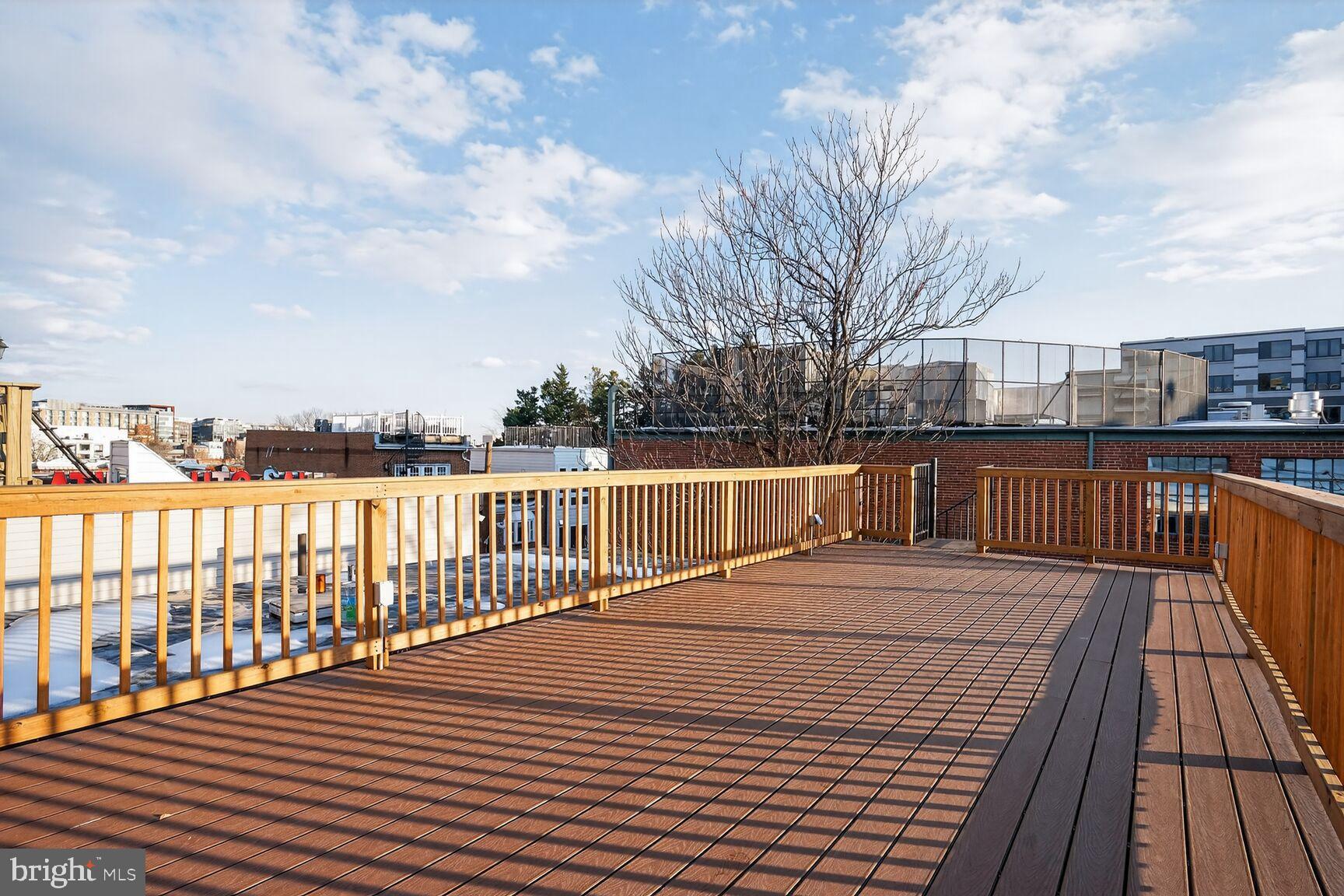 1316 Florida Avenue Northwest Washington, DC 20009 - Photo 40 of 43 a view of wooden deck with a lake
