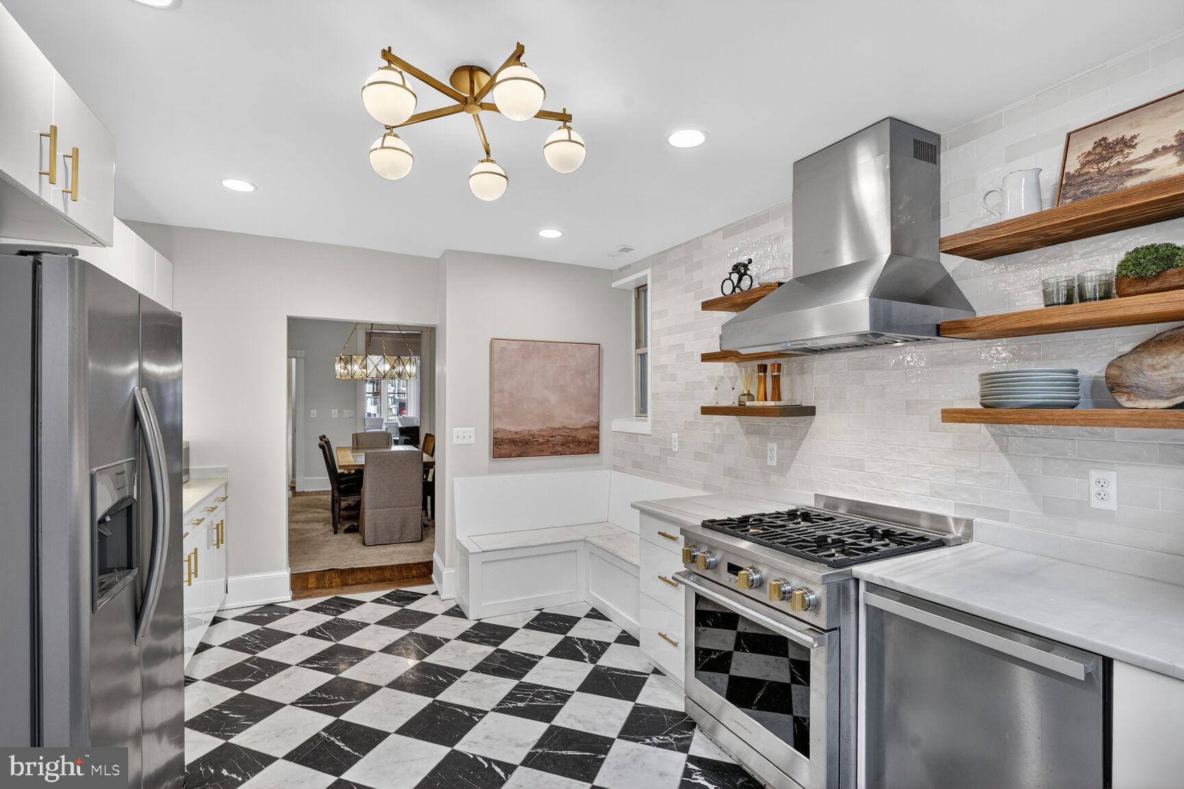1316 Florida Avenue Northwest Washington, DC 20009 - Photo 10 of 43 a kitchen with stainless steel appliances granite countertop a sink stove and refrigerator