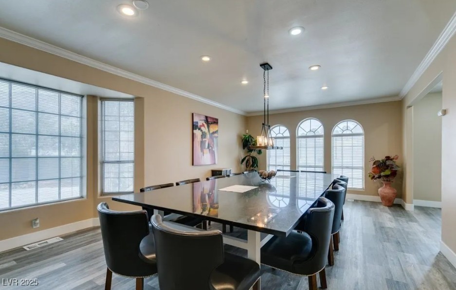 6520 Turtle Hill Road Las Vegas, NV 89110 - Photo 11 of 59 Dining space with crown molding, light wood-style flooring, and recessed lighting