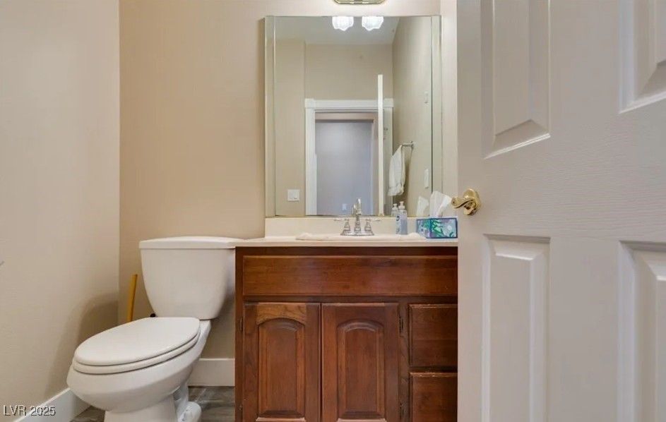 6520 Turtle Hill Road Las Vegas, NV 89110 - Photo 22 of 59 Half bath with vanity and toilet