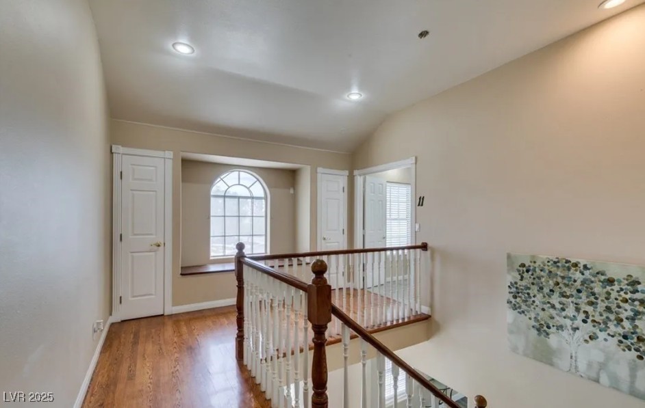 6520 Turtle Hill Road Las Vegas, NV 89110 - Photo 23 of 59 Hallway with light wood-style floors, an upstairs landing, lofted ceiling, and recessed lighting