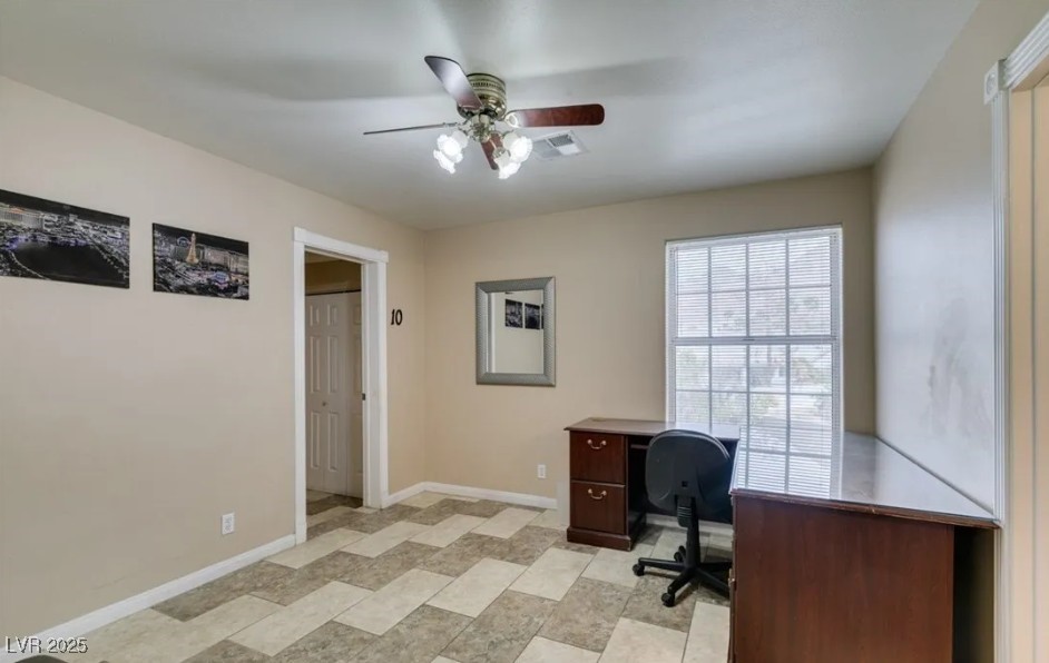 6520 Turtle Hill Road Las Vegas, NV 89110 - Photo 25 of 59 Home office featuring baseboards and a ceiling fan