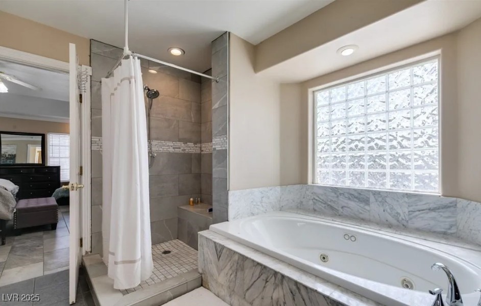6520 Turtle Hill Road Las Vegas, NV 89110 - Photo 35 of 59 Full bathroom with a tub with jets, ensuite bath, a stall shower, tile patterned flooring, and recessed lighting