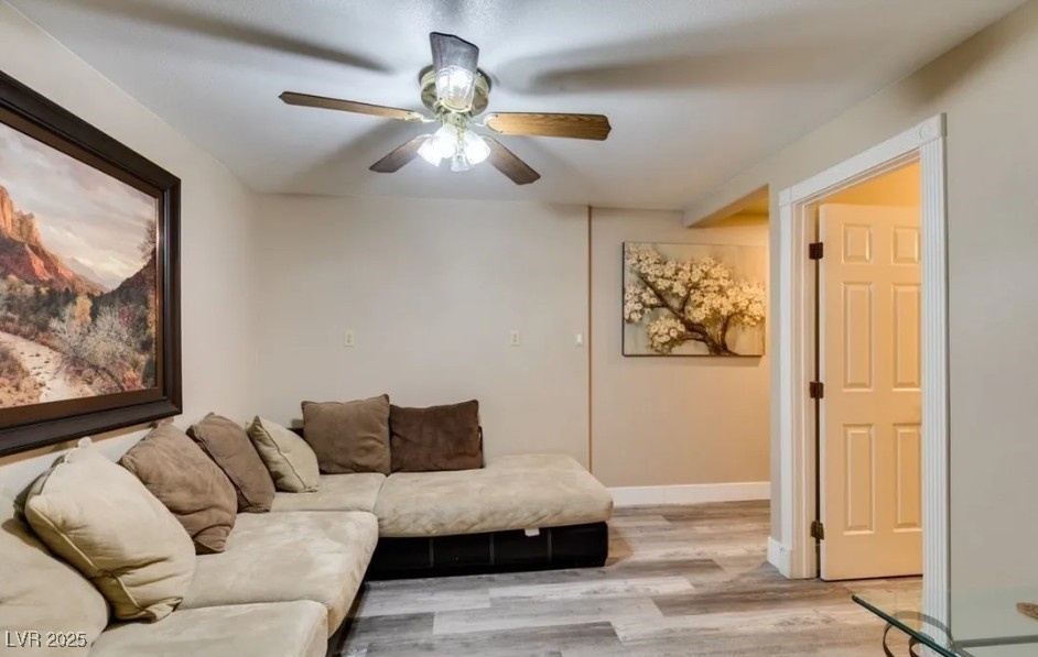 6520 Turtle Hill Road Las Vegas, NV 89110 - Photo 37 of 59 Living room with light wood-style flooring and ceiling fan