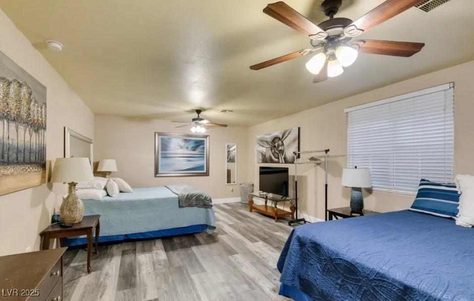 6520 Turtle Hill Road Las Vegas, NV 89110 - Photo 39 of 59 Bedroom with light wood-style floors and ceiling fan