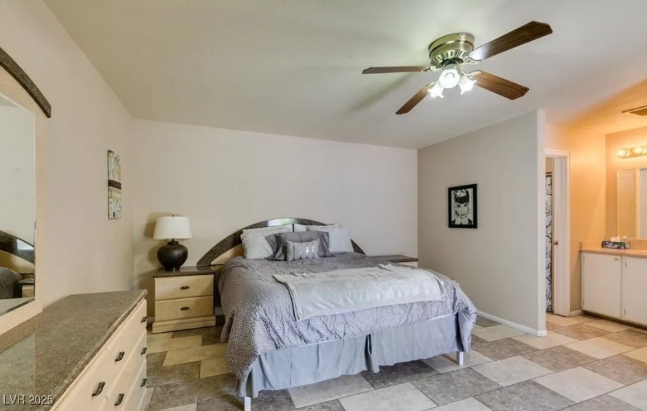 6520 Turtle Hill Road Las Vegas, NV 89110 - Photo 43 of 59 Bedroom with a ceiling fan and ensuite bathroom