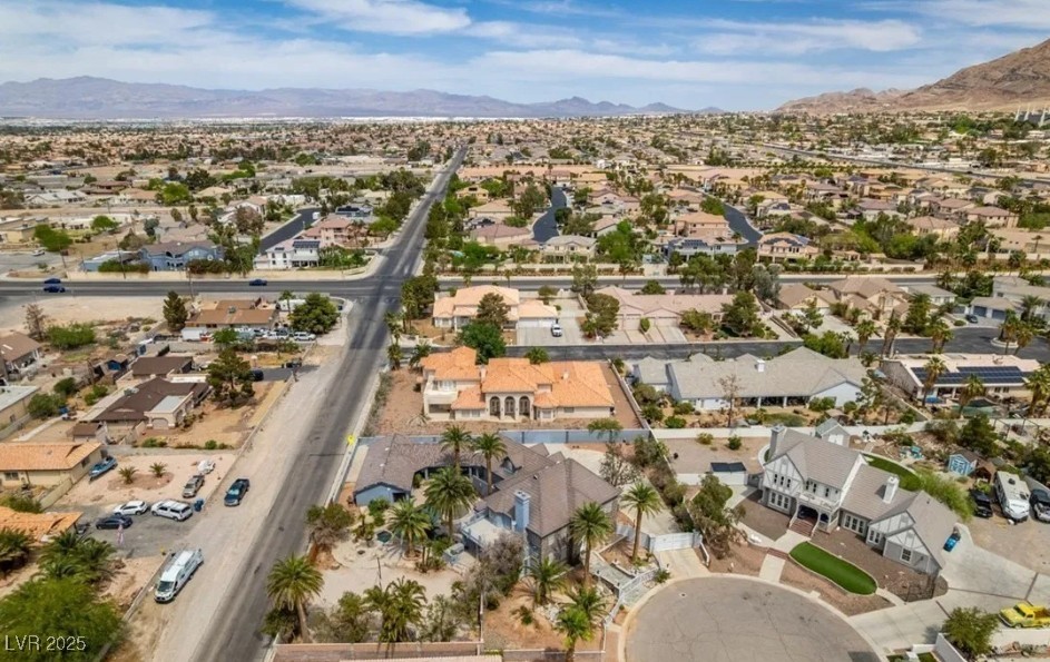6520 Turtle Hill Road Las Vegas, NV 89110 - Photo 5 of 59 Aerial view of property and surrounding area featuring a mountainous background and nearby suburban area