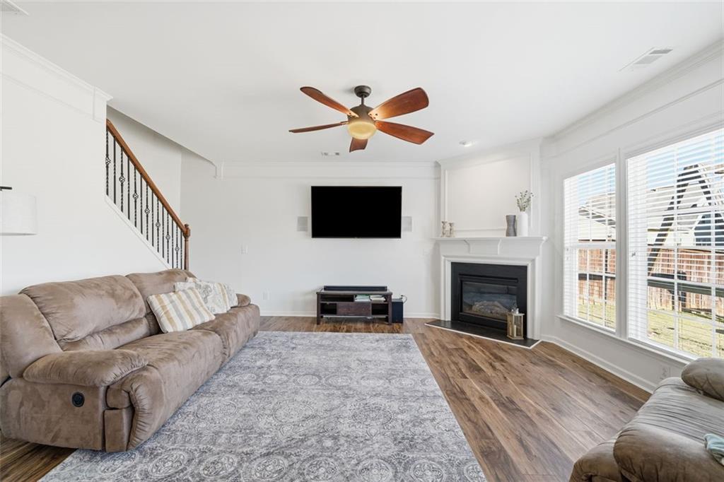 503 White Oak Path Canton, GA 30115 - Photo 16 of 47 a living room with furniture flat screen tv and a fireplace