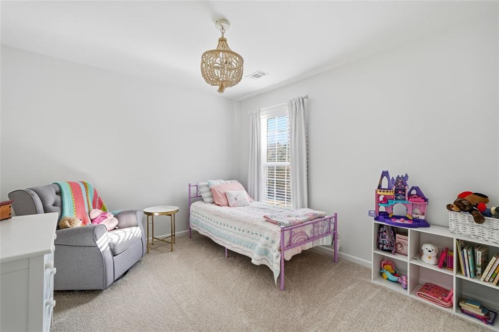503 White Oak Path Canton, GA 30115 - Photo 29 of 47 a bedroom with a bed and a window