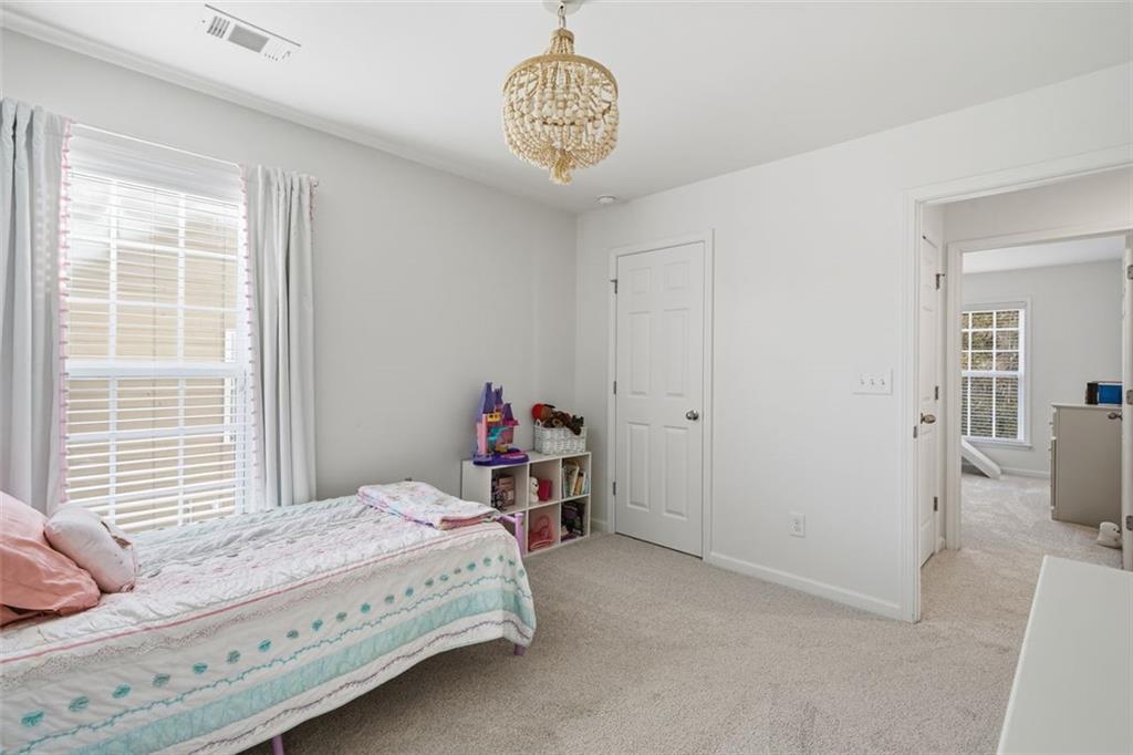 503 White Oak Path Canton, GA 30115 - Photo 30 of 47 a bedroom with a bed and a window