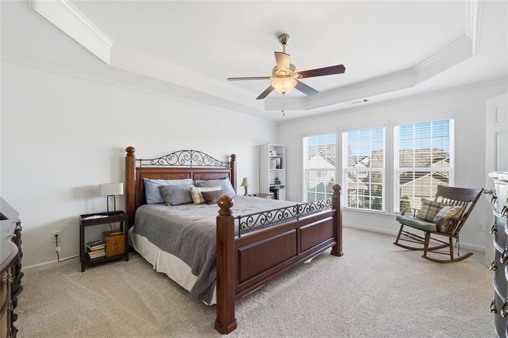 503 White Oak Path Canton, GA 30115 - Photo 31 of 47 a bedroom with a bed chair and a large window