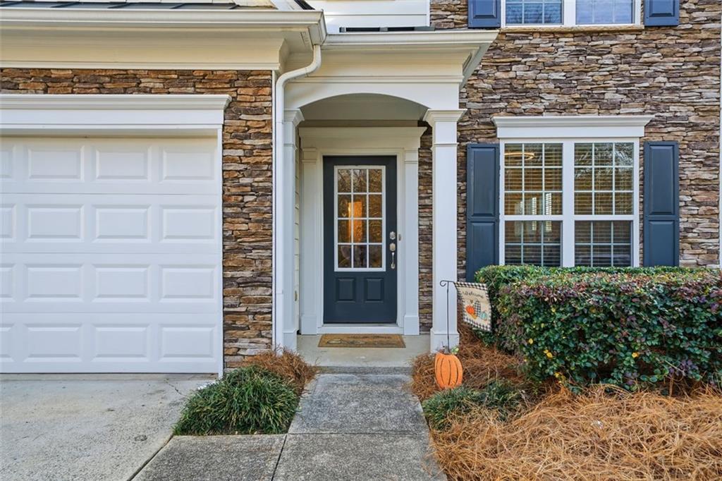 503 White Oak Path Canton, GA 30115 - Photo 7 of 47 a front view of a house with potted plants