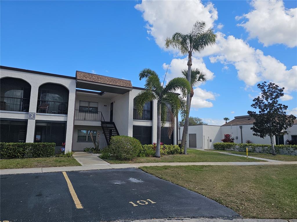 7701 Starkey Road, Unit 102 Seminole, FL 33777 - Photo 23 of 24 a view of a house with a yard