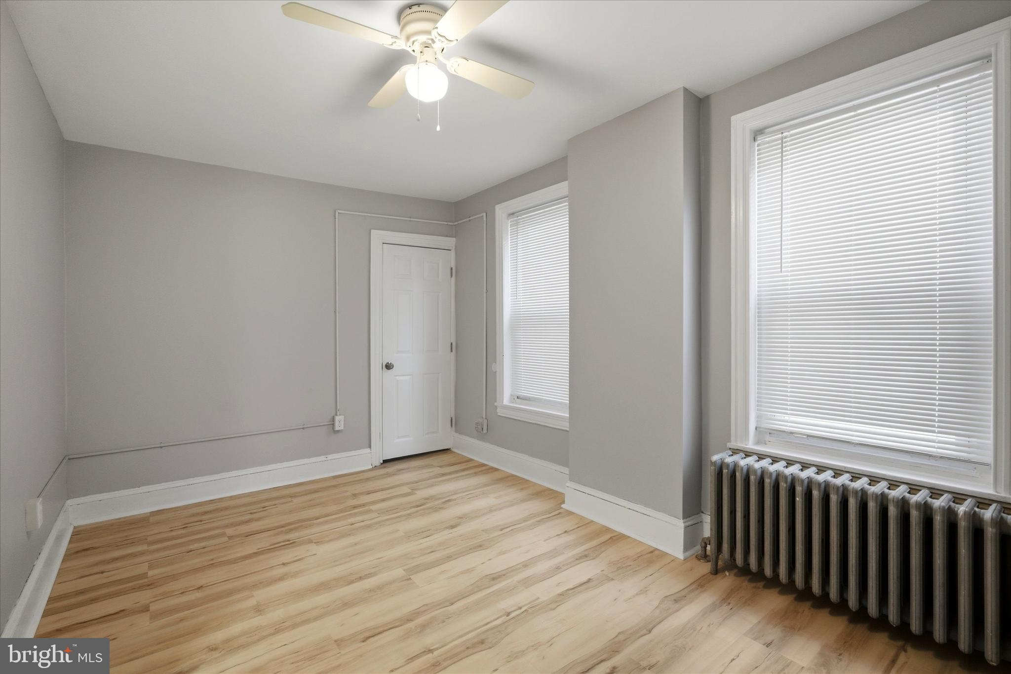106 West 5th Street Bridgeport, PA 19405 - Photo 15 of 26 a view of an empty room with wooden floor and a window