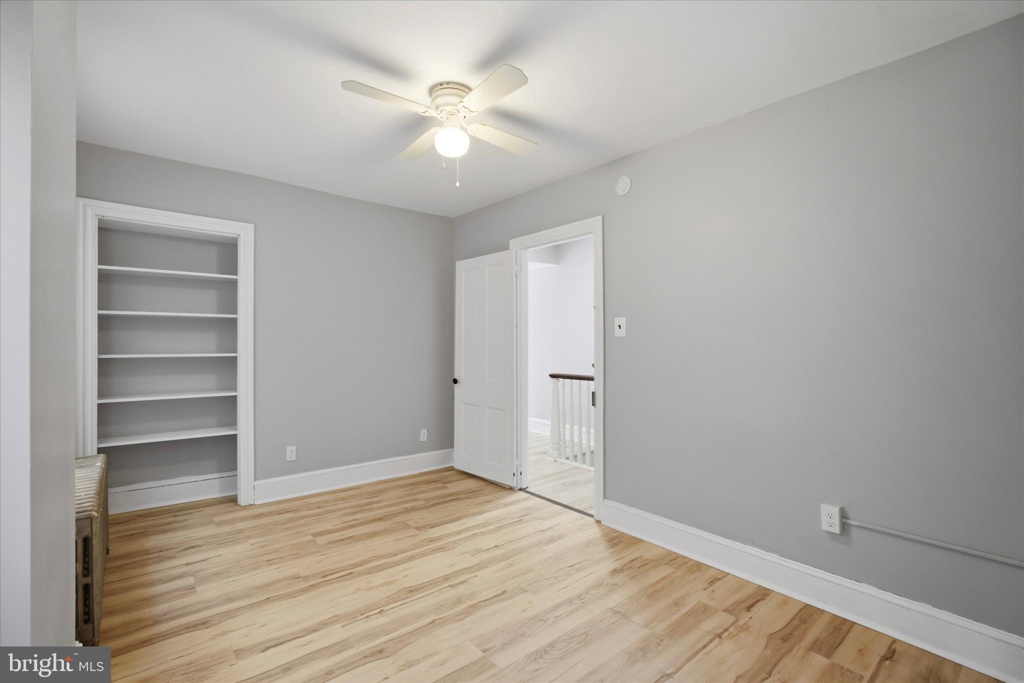 106 West 5th Street Bridgeport, PA 19405 - Photo 16 of 26 a view of an empty room with a window and wooden floor
