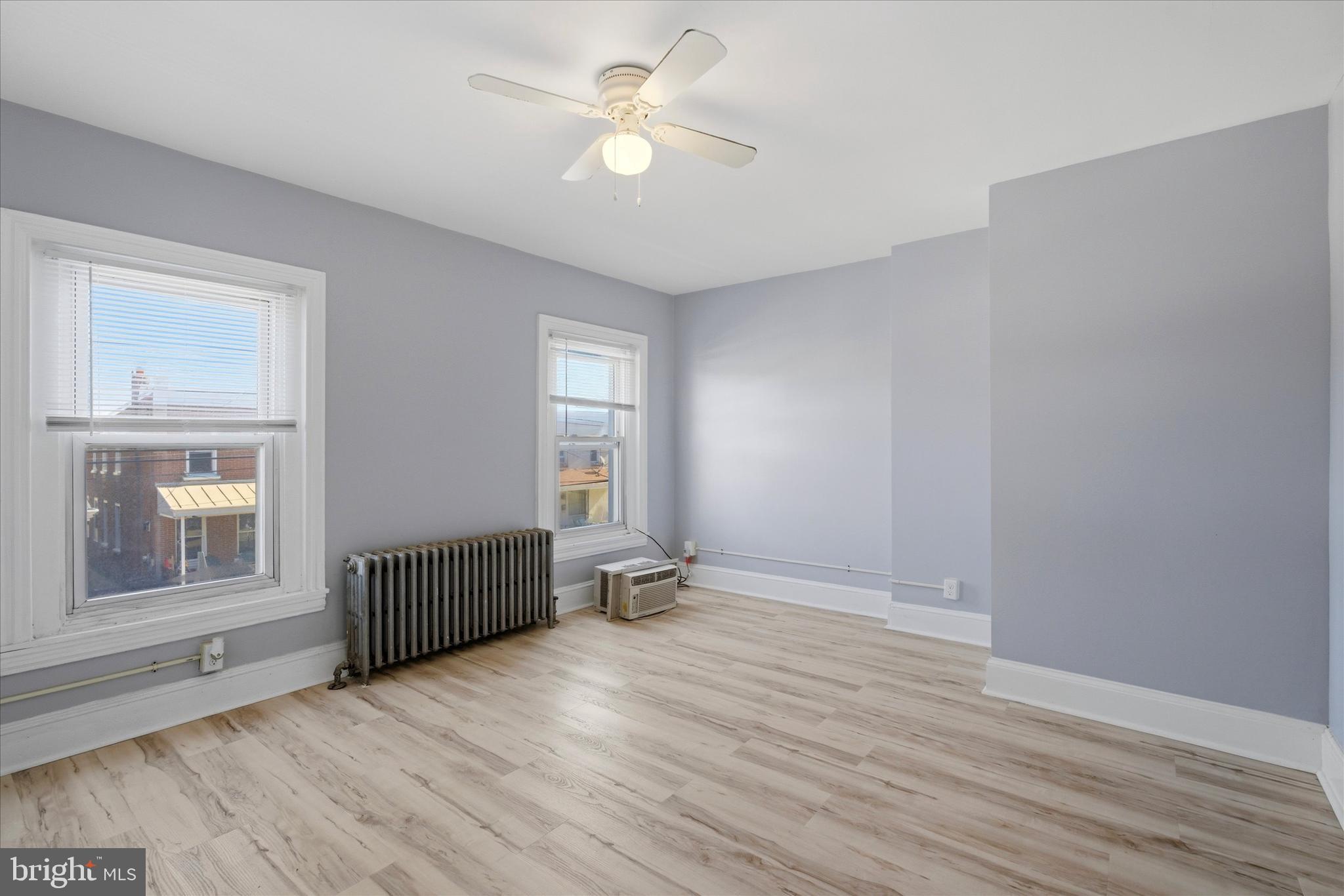 106 West 5th Street Bridgeport, PA 19405 - Photo 17 of 26 wooden floor in an empty room with a window