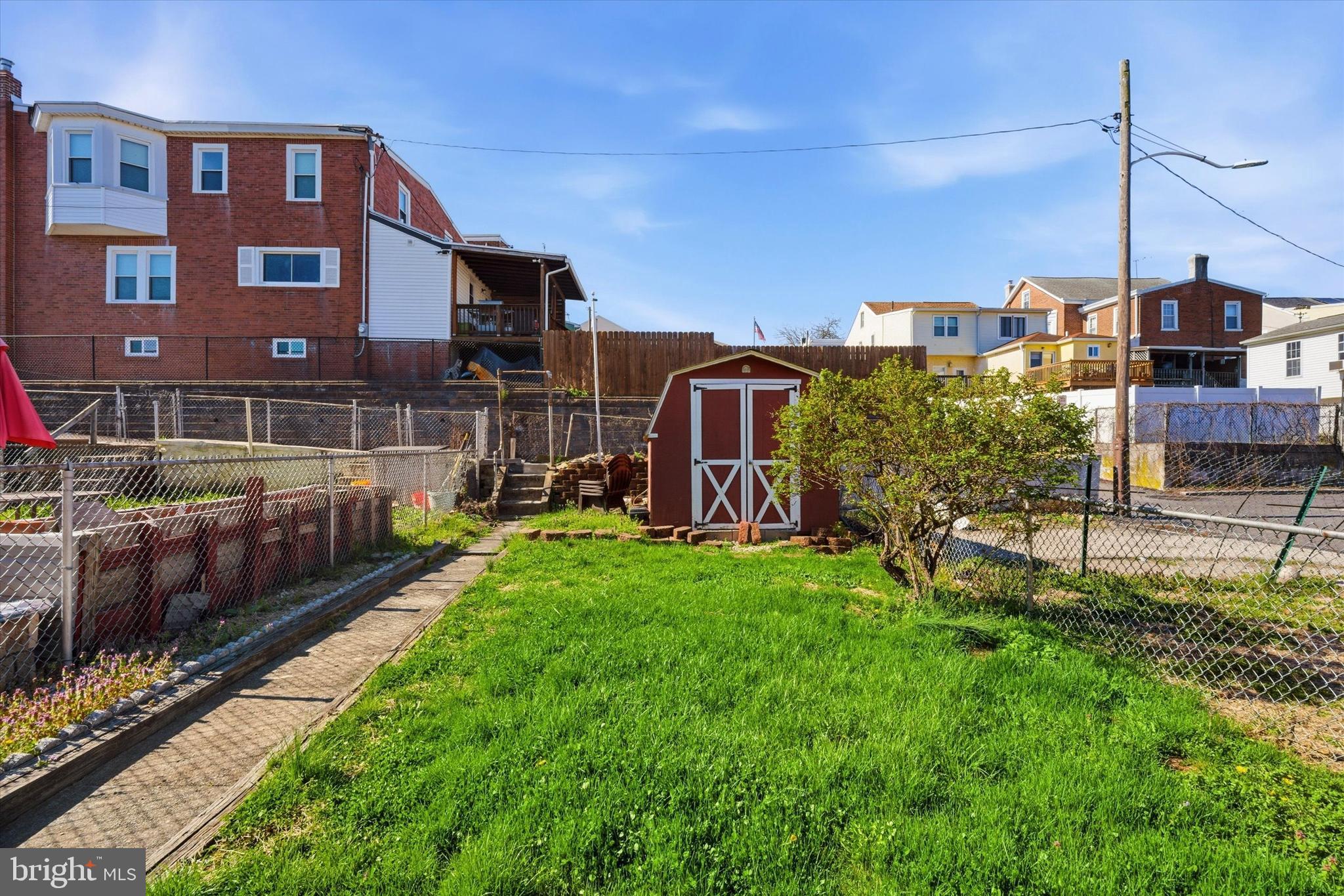 106 West 5th Street Bridgeport, PA 19405 - Photo 25 of 26 a view of a garden with a building in the background