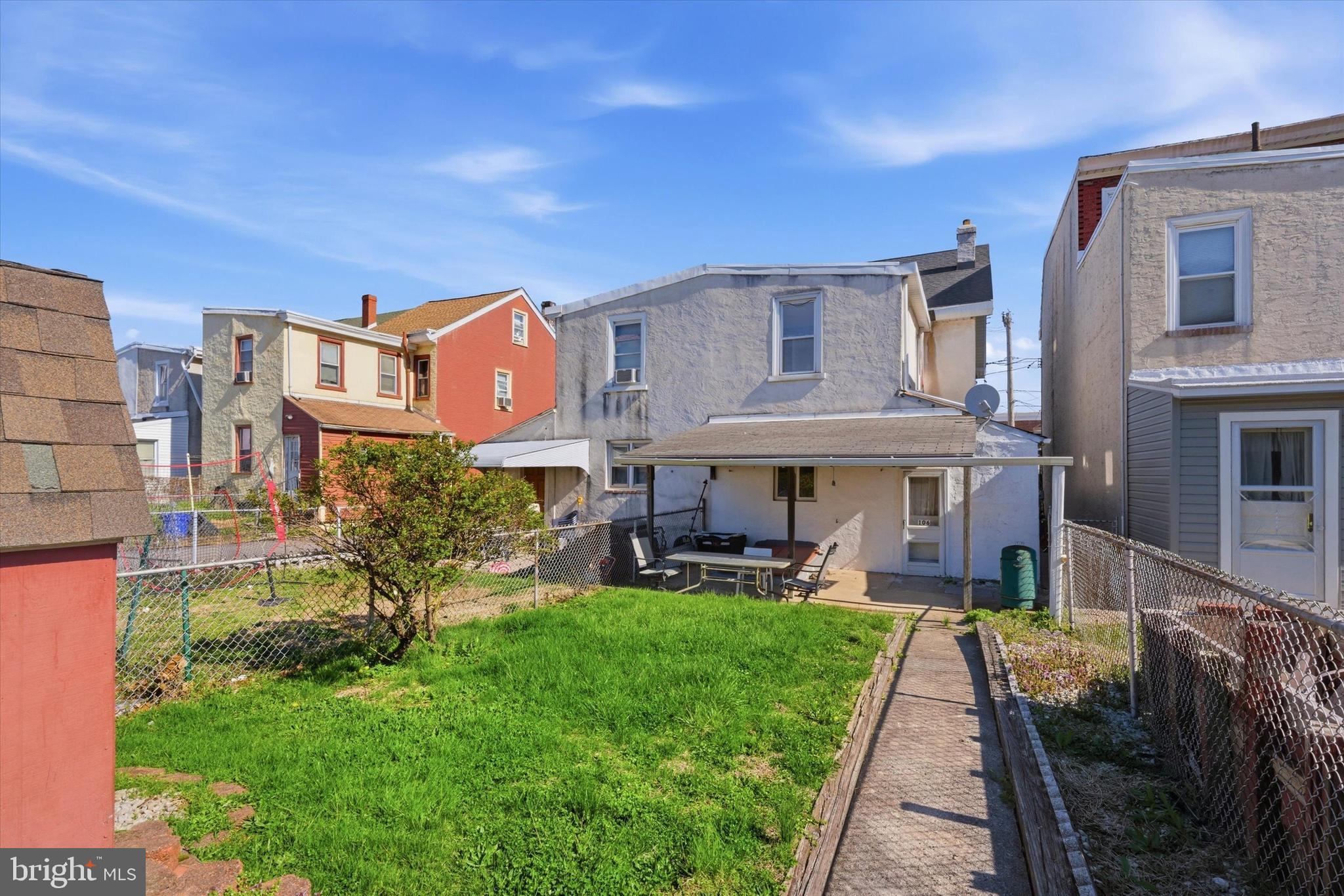 106 West 5th Street Bridgeport, PA 19405 - Photo 26 of 26 a front view of a house with a yard table and chairs