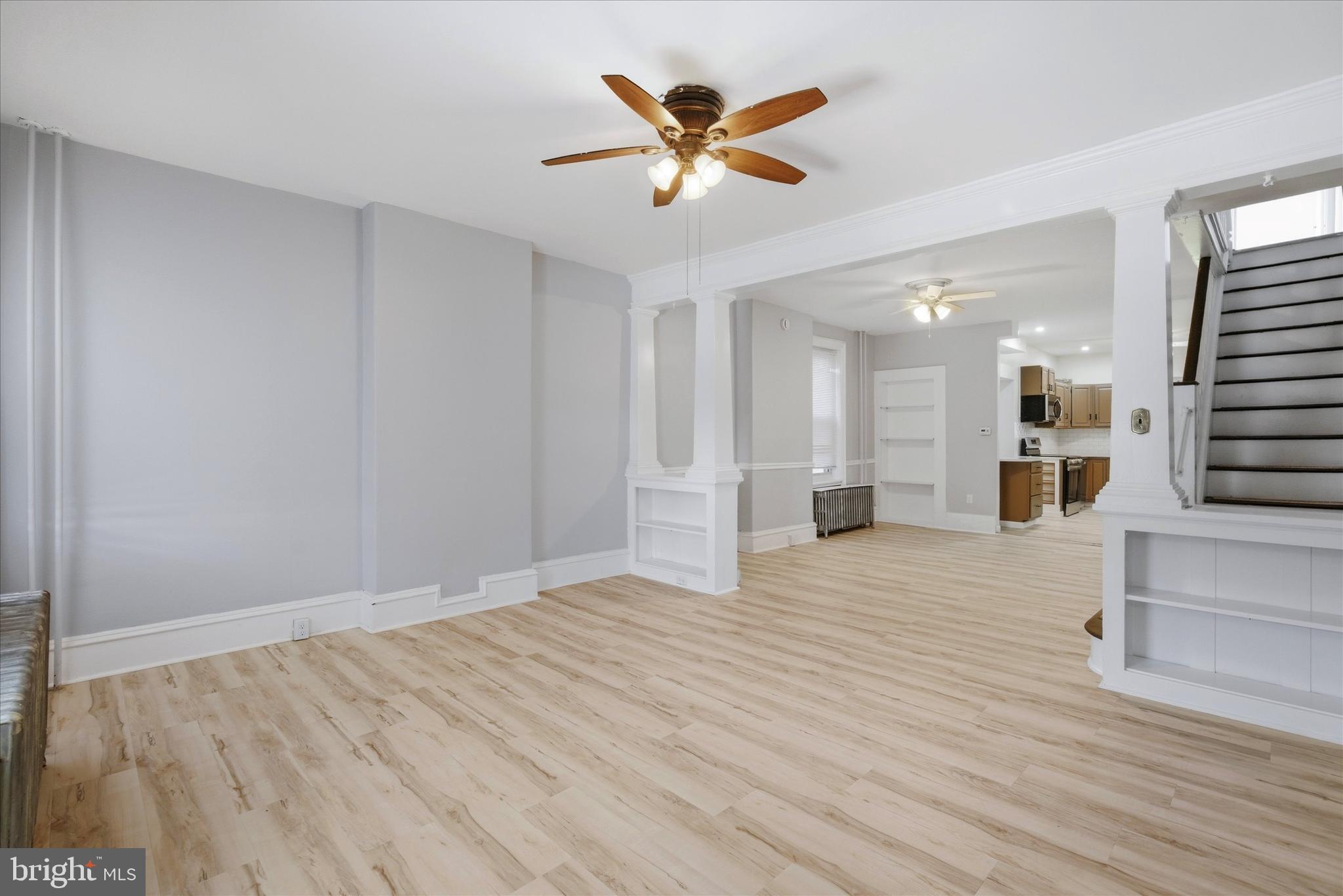 106 West 5th Street Bridgeport, PA 19405 - Photo 4 of 26 wooden floor in an empty room with a ceiling fan