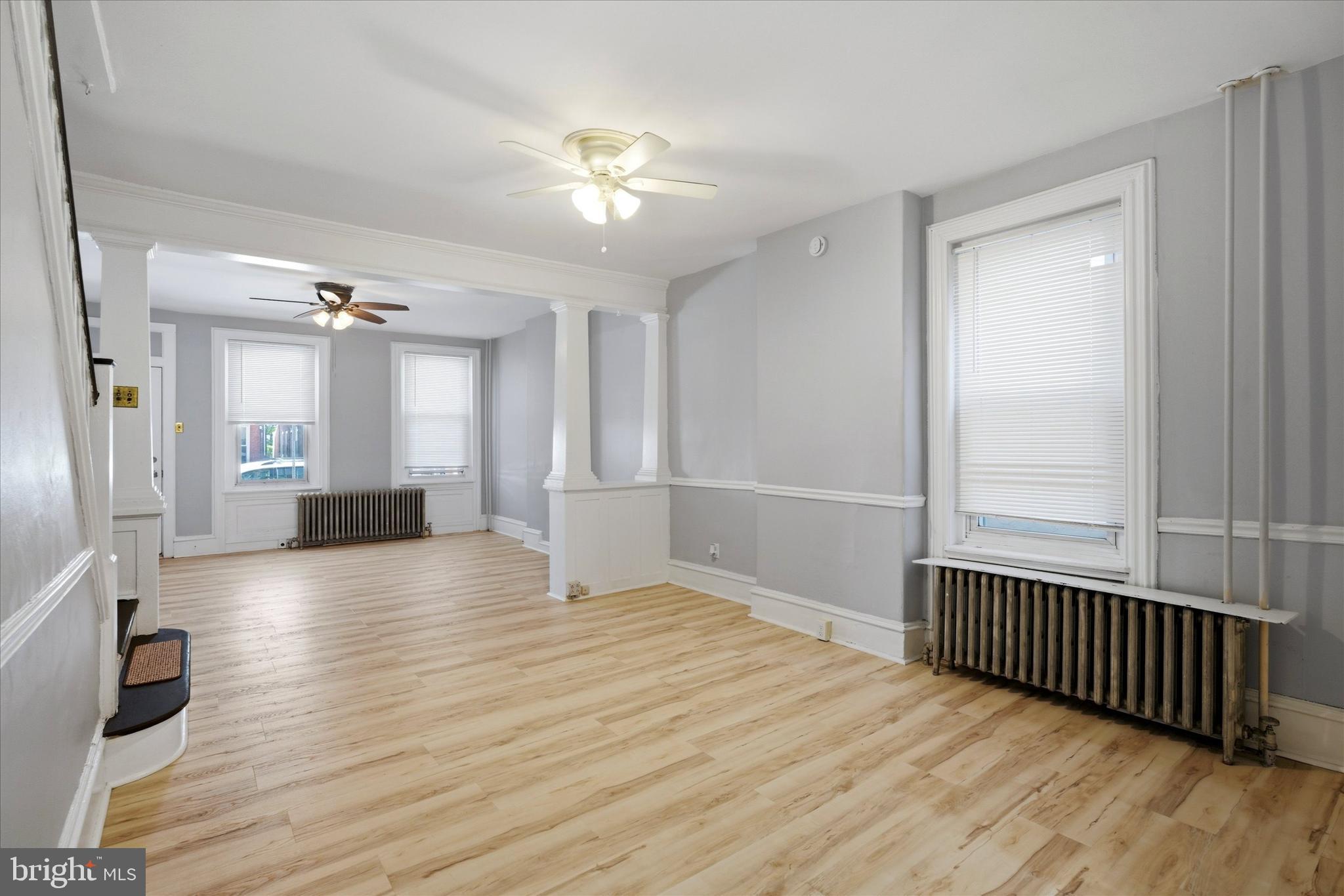 106 West 5th Street Bridgeport, PA 19405 - Photo 7 of 26 wooden floor in an empty room with a window