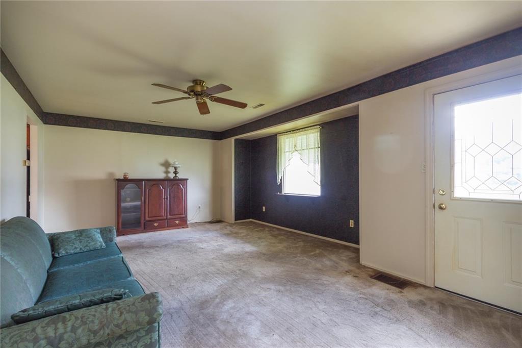 1918 Maratta Road Aliquippa, PA 15001 - Photo 6 of 18 From the front door, the far end could be used for a kitchen table and chairs if you turn the third bedroom back into a bedroom!