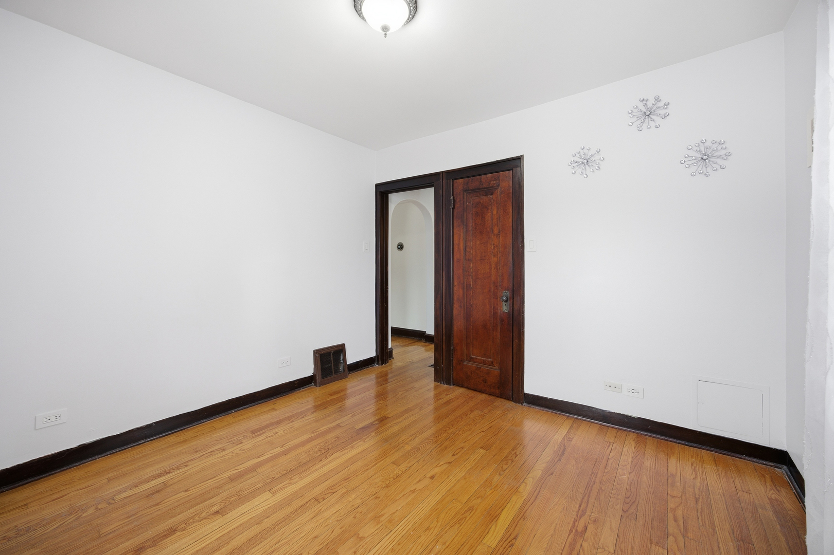 2557 Oak Street River Grove, IL 60171 - Photo 13 of 42 a view of an empty room with wooden floor and a window