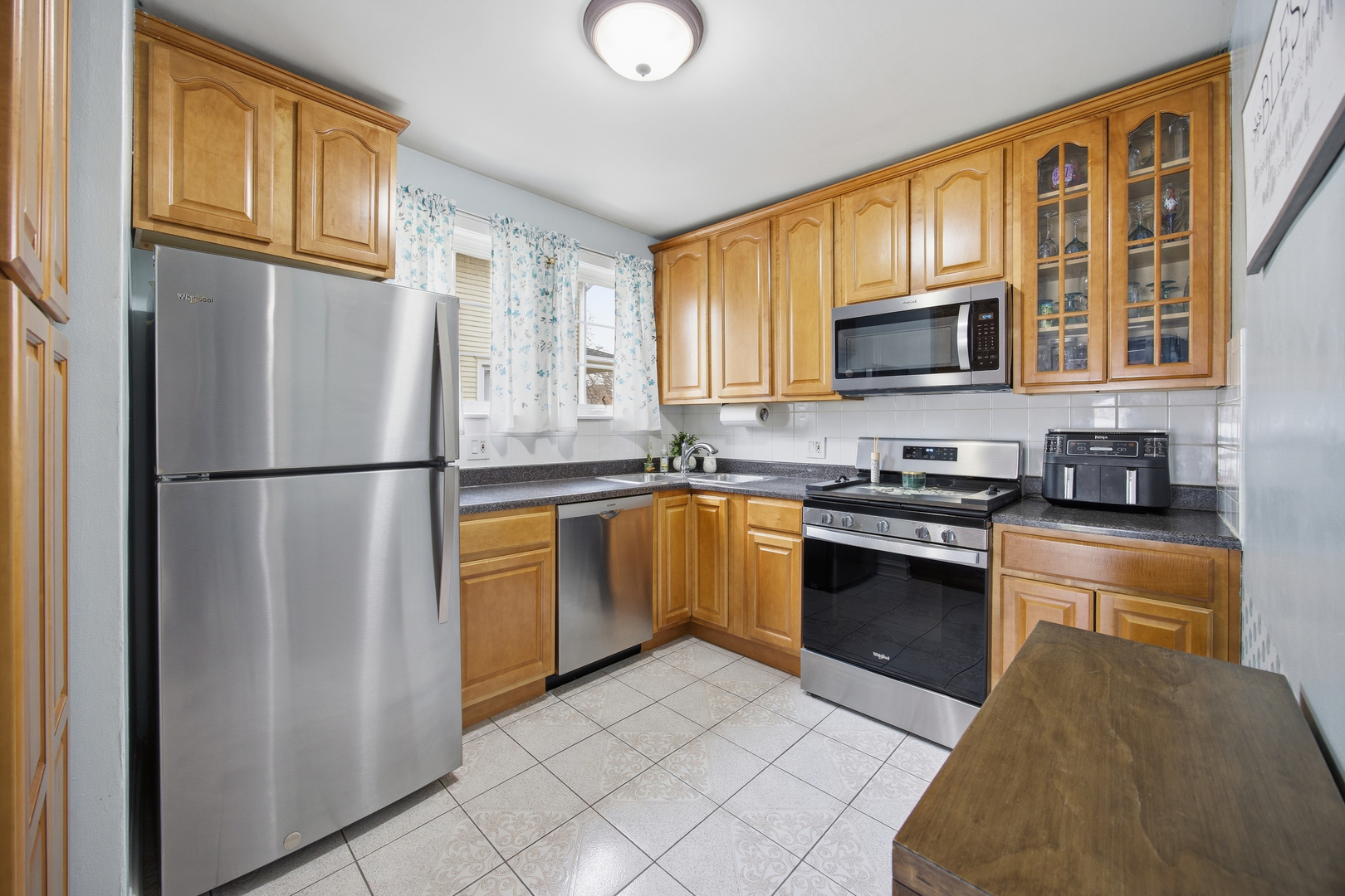 2557 Oak Street River Grove, IL 60171 - Photo 7 of 42 a kitchen with stainless steel appliances granite countertop a refrigerator stove top oven a sink and dishwasher
